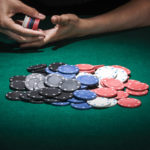 different poker chips on casino table